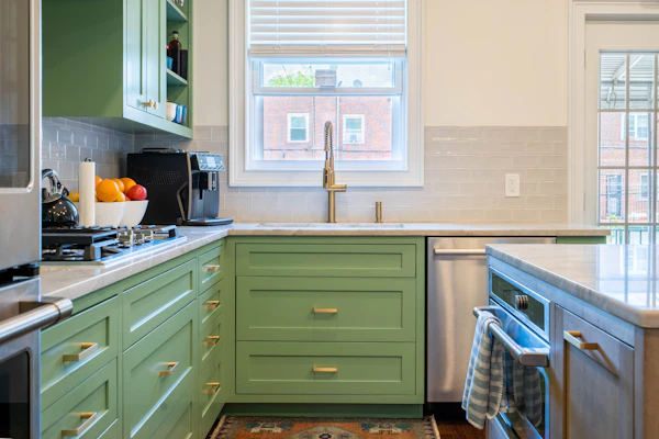 Example photo: a kitchen with green painted shaker-style cabinets
